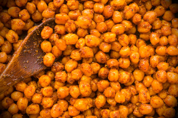 istock Cooking chickpeas with spices in a pan, close-up 1310924908
