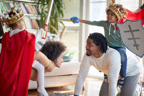 istock Joyful afro american parents playing with their kids 1310925728