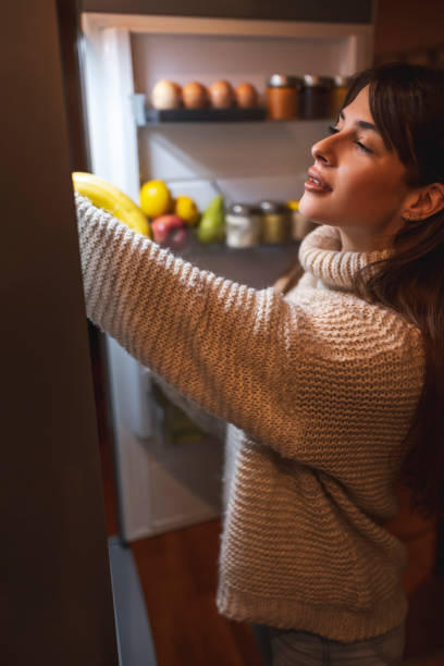 istock Woman taking food from fridge 1310926096