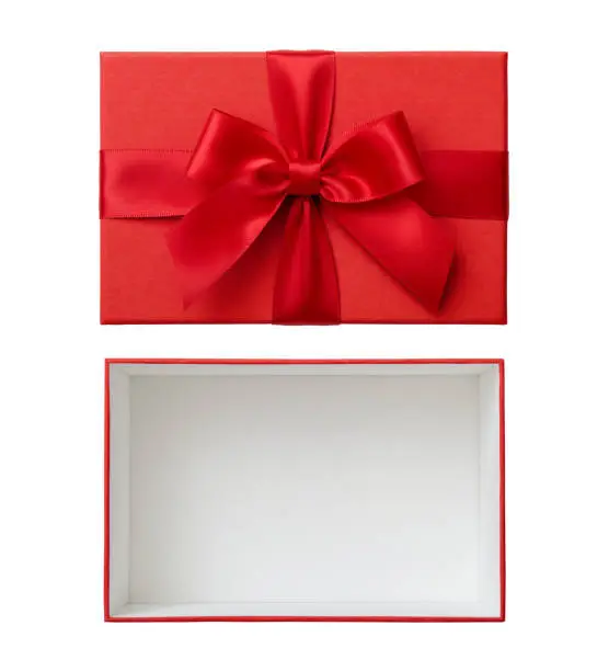 Photo of Open rectangular red gift box and lid with red ribbon bow cut out on white background