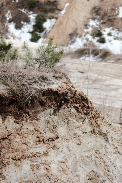 istock Sand quarry partly covered with melting snow 1310932679