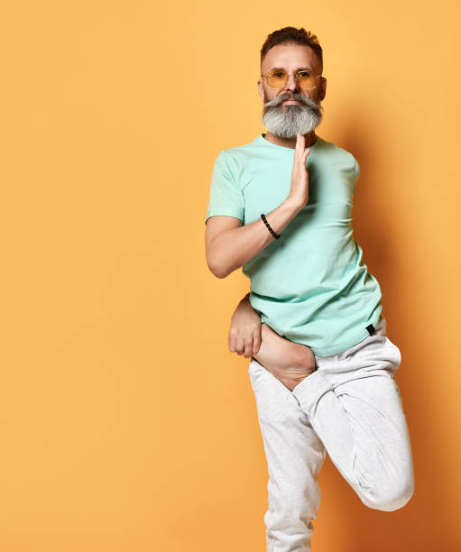 istock Healthy bearded man standing on one leg practicing yoga portrait 1310933139