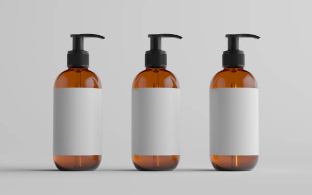 istock Amber Glass Pump Bottle Mock-Up - Liquid Soap, Shampoo Dispenser - Three Bottles. Blank Label 1310934376