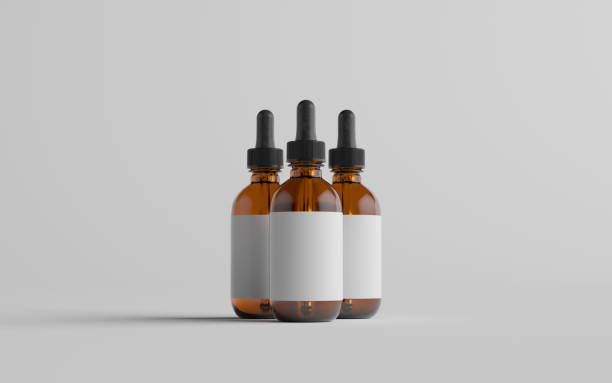 istock Amber Glass Dropper Bottle Mockup - Three Bottles. Blank Label 1310934394