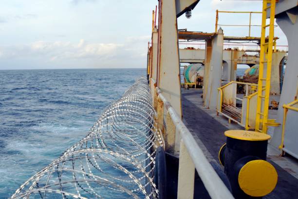 Barbed wire or razor wire attached to the ship hull, superstructure and railings to protect the crew against piracy attack.