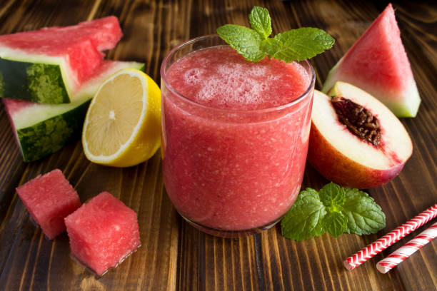istock Smoothie from watermelon and nectarine on the brown  wooden background 1310935123