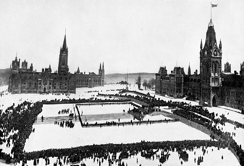 The Trooping the Colour of the new North-West Mounted Police battalion at Parliament Hill before leaving Ottawa, Canada for the Second Boer War in South Africa. Vintage etching circa 19th century. This is the original Centre Block, it would be destroyed by fire in 1916.