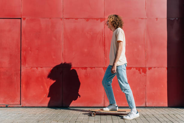 istock Young man skating on the city on a summer day 1310937323