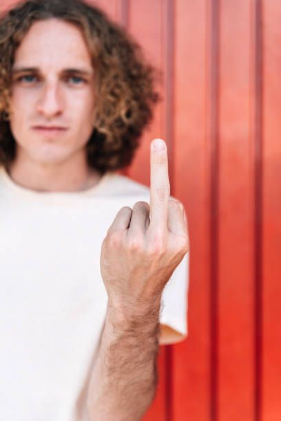 istock Hand with middle finger raised with rude gesture 1310937405