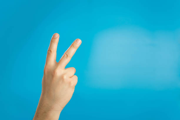 istock Hand with two fingers up in the peace or victory symbol. 1310937721