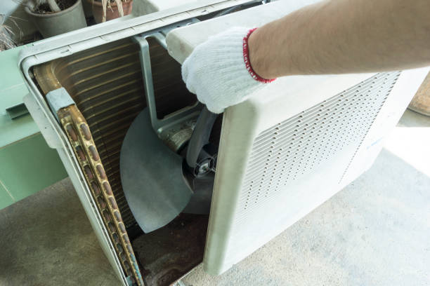 istock Technician open air conditioner compressor body, Checking air conditioner compressor, Home appliances repair service. 1310938960