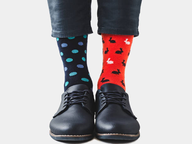 istock Men's legs, trendy shoes and bright socks 1310946123
