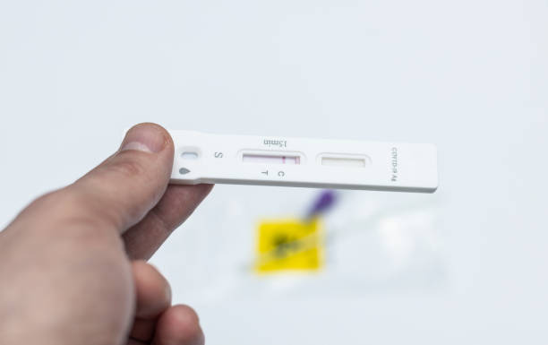istock COVID 19, a man holding a negative antigen test in his hand, close-up. 1310946164