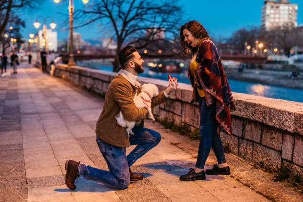 Young man proposing to his girlfriend