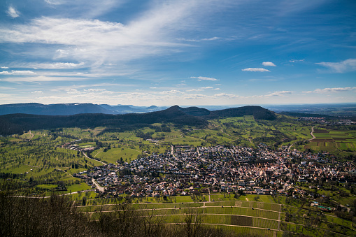 Germany, Endless aerial view above the roofs, houses and streets of neuffen city from above, panorama perspective in springtime on sunny day