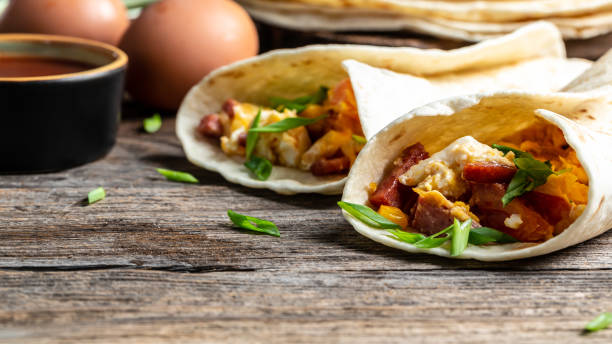 istock Mexican tortilla quesadilla with scramble eggs, vegetables, ham and cheese, Mexican cuisine, Mexico and Latin America traditional restaurant menu dish, food cooking recipe book cover 1310947379