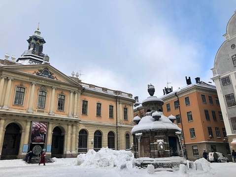 Stockholm, Sweden - February 3, 2019: View of the Nobel Prize Museum, in Gamla Stan square, covered in snow during winter in Stockholm