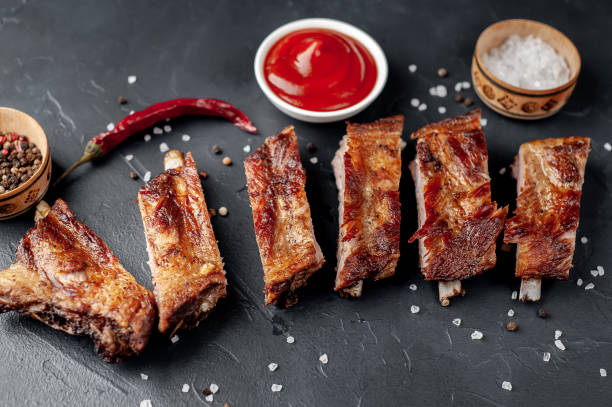 istock grilled pork ribs with spices on a stone background 1310955136
