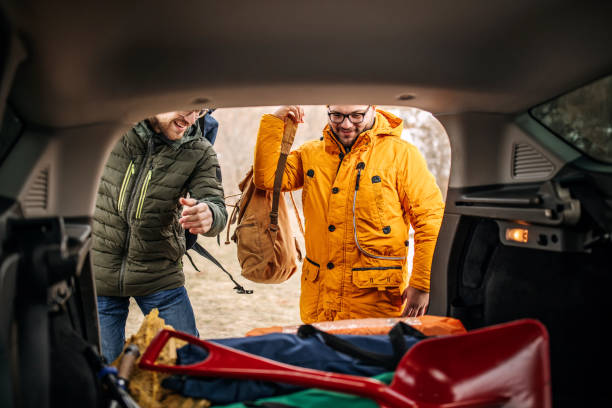 istock Friends on hiking taking backpacks from the car trunk 1310956407