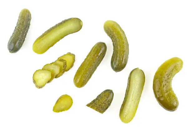 Set of delicious marinated pickled cucumbers isolated on a white background, top view.
