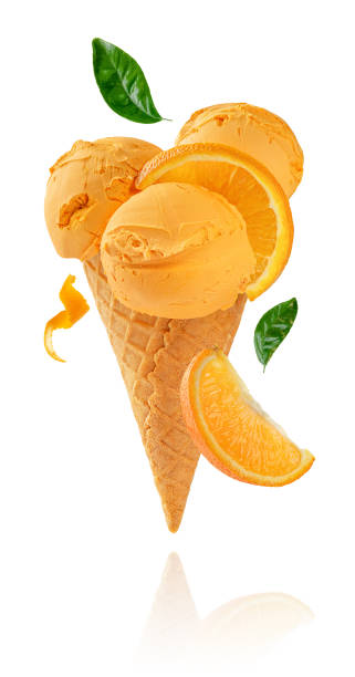 Orange fruit ice cream Orange fruit ice cream cone isolated on white background with clipping path levitation stock pictures, royalty-free photos & images