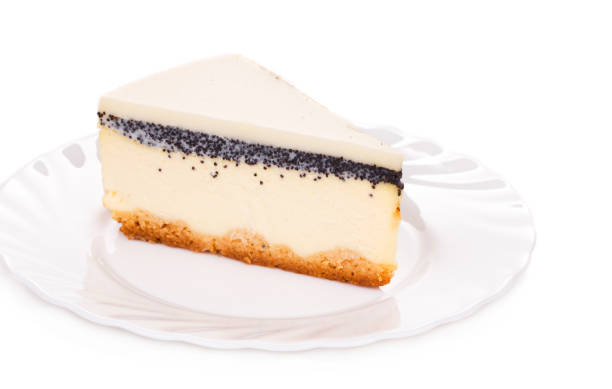 Piece of vanilla cheesecake on a white plate.