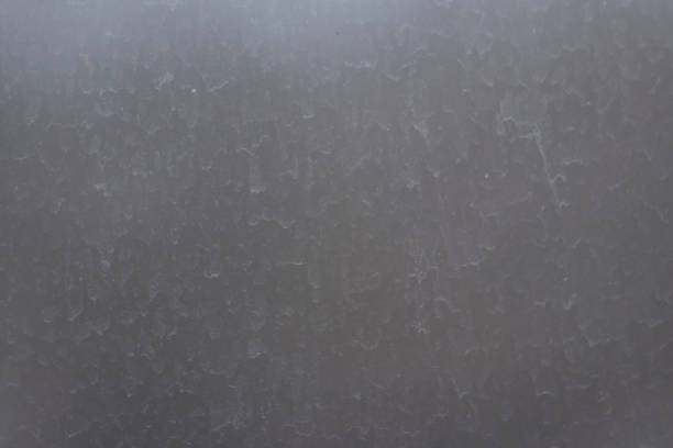 istock Blurred streaks of dust and dirt on the unwashed window. 1310961653