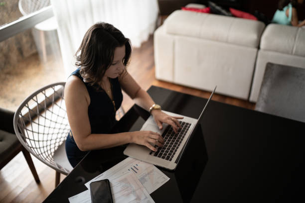 istock Dedicated mature woman working at home 1310961972