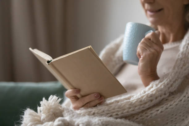 istock Senior elderly lady wrapped in woolen comforter 1310961991