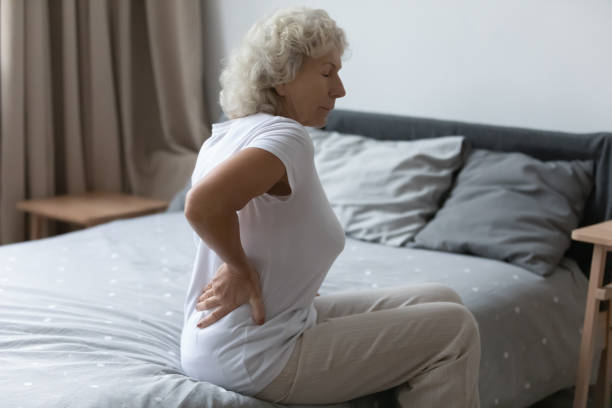 istock Tired upset elderly woman feeling strong lower backpain 1310962016