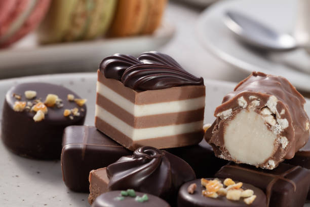 sweet dessert with macaroons and assorted chocolates