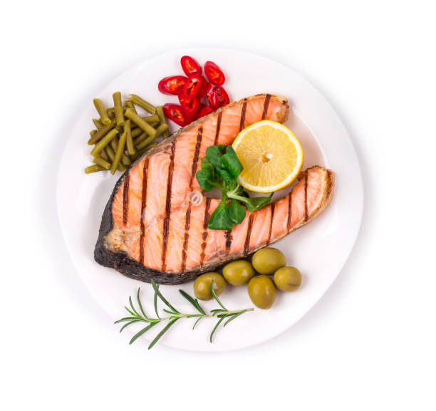 istock Grilled salmon steak with vegetables on a plate. 1310962283