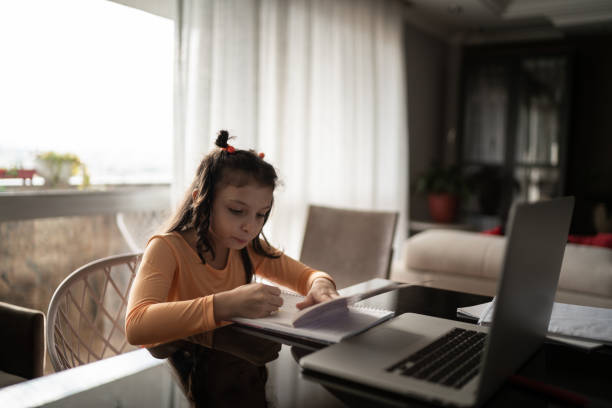 istock Focused girl drawing at home 1310962374