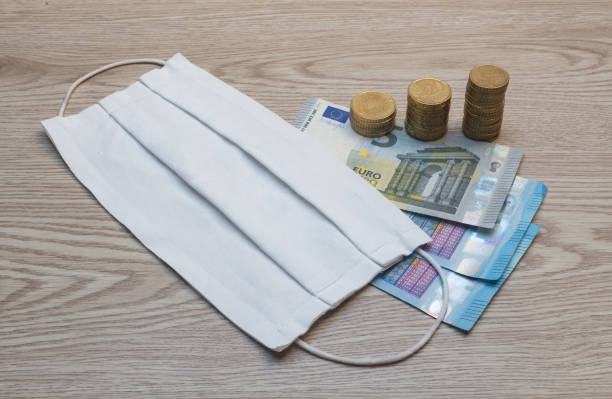 istock Fabric mask and money 1310966072