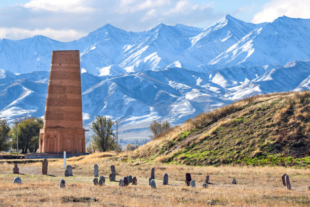 Ancient site of Burana near Bishkek, Kyrgyzstan. Ancient site of Burana with old minaret and tombstones known as Balbas in Kyrgyzstan. bishkek photos stock pictures, royalty-free photos & images