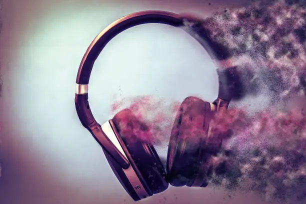 headphones seem like music is coming out of them. represents music in motion. Dust comes out of the earphone. the earphone and the music fade. Sensation of movement