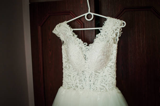 istock White wedding dress on the cloth hanger 1310970285