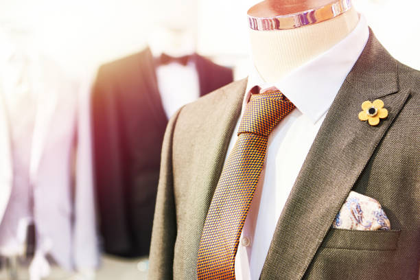 Men's suits with shirts and ties in the clothing store
