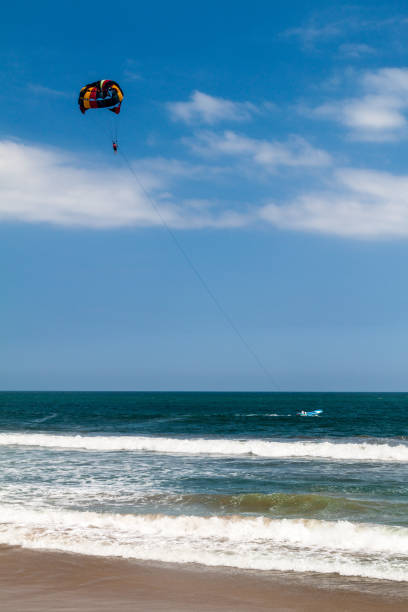 Kitesurfing in Montanita village, Ecuador Kitesurfing in Montanita village, Ecuador kiteboarding stock pictures, royalty-free photos & images