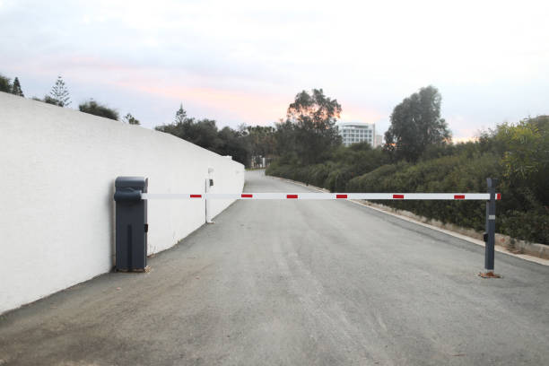 istock parking barrier system, automatic car park security system. barrier to the closed area of the hotel 1310973594