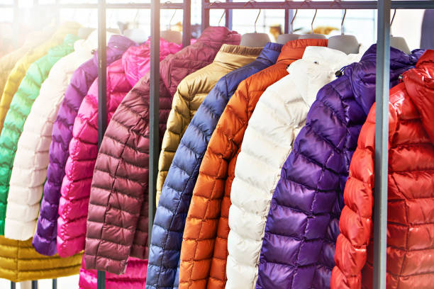 istock Winter women's jackets on hanger in store 1310973678