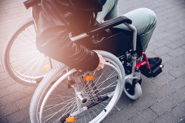 istock Close up of disabled man on wheelchair. 1310976203