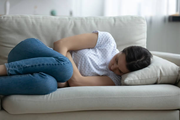 istock Close up unhappy frustrated young woman lying on couch alone 1310977375