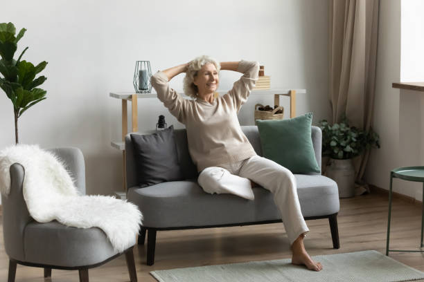 istock Happy middle aged 60s pensioner spending leisure time at home 1310977407