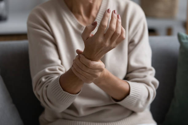istock Middle aged elderly woman feeling wrist pain 1310977434