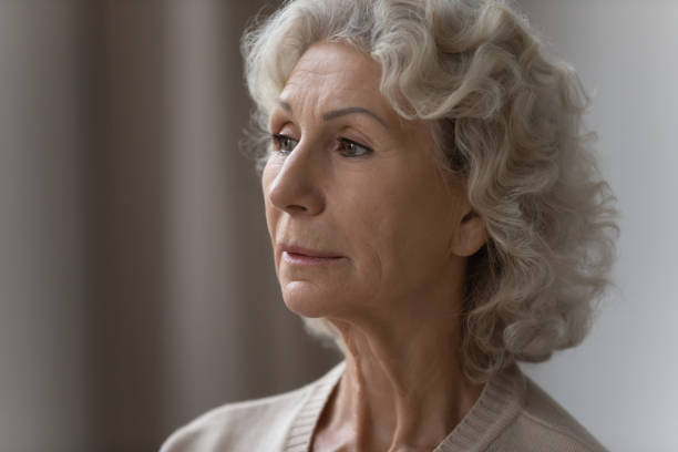 istock Pensive confused elderly 70s lady lost in thoughts 1310977442