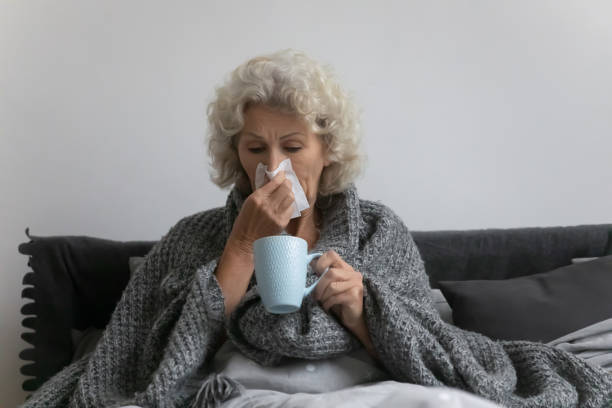 istock Sick mature senior woman suffering from flu, cold 1310977453