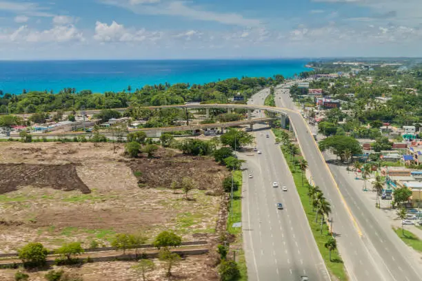 BOCA CHICA, DOMINICAN REPUBLIC - SEP 25, 2015: Aerial view of Boca Chica town in Dominican Republic. Highway 3 and crossing to Las Americas International Airport of Santo Domingo.