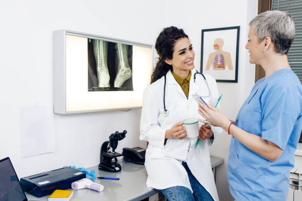 istock Two colleagues in medical clinic using smartphone and consulting about work 1310981525