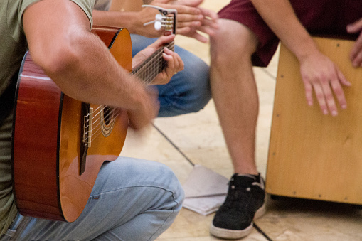 Close-up of a group of people playing music in the street